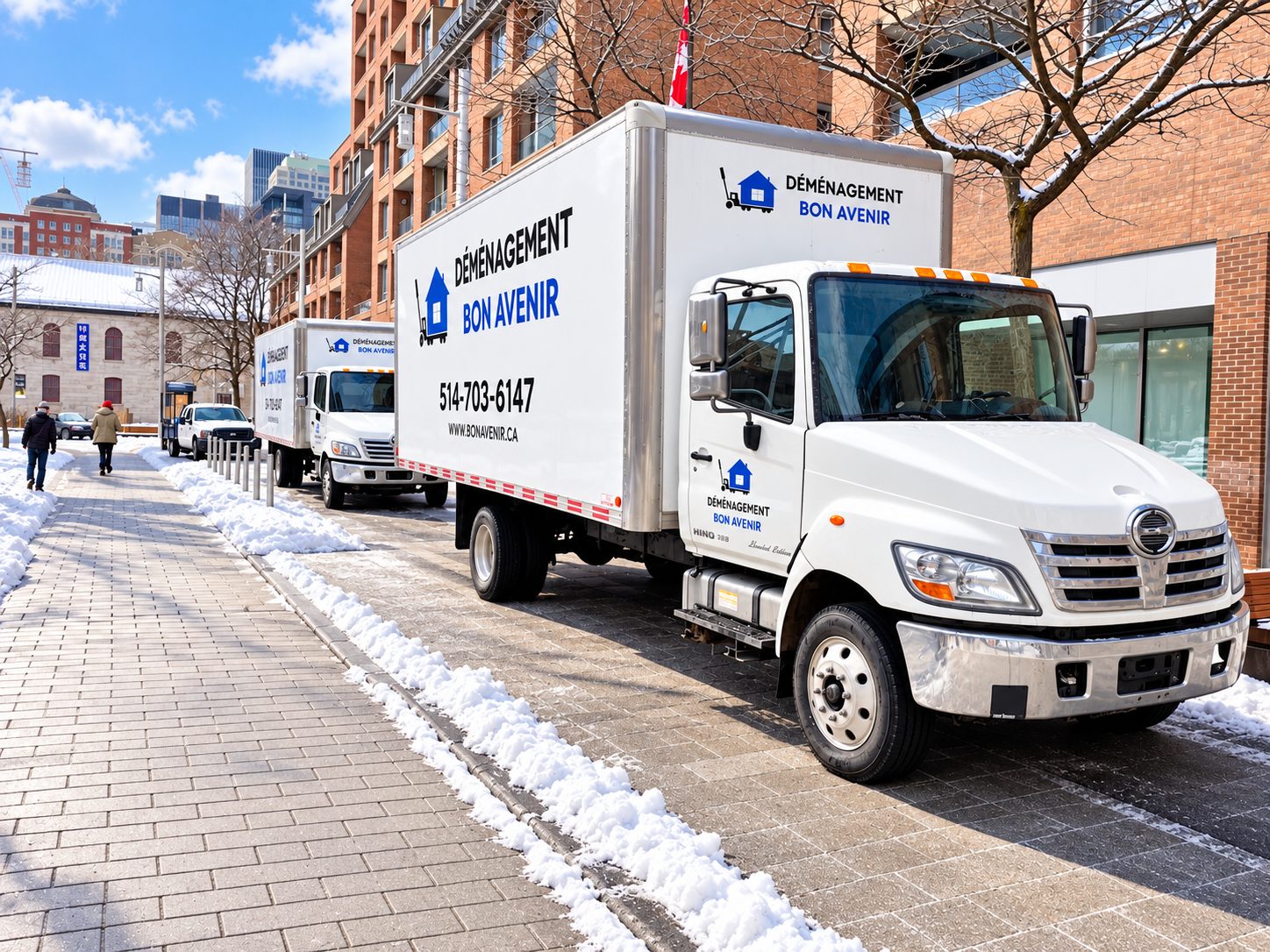 Deux camions de Déménagement Bon Avenir stationnés dans une rue commerciale de Montréal en hiver lors d’un déménagement de bureaux